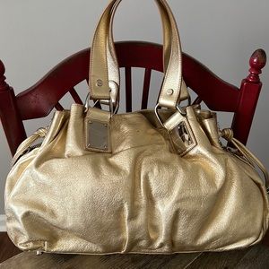 Michael Kors gold bag.
